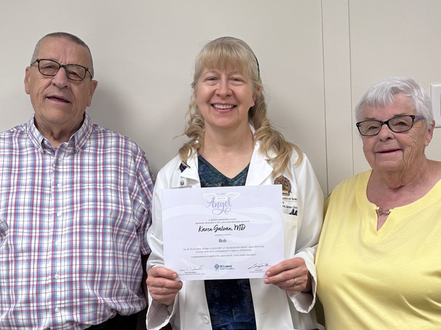 Bob and Sandy pose with Dr. Galvan.