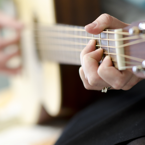 Person playing guitar