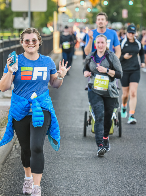  Runners wave at camera
