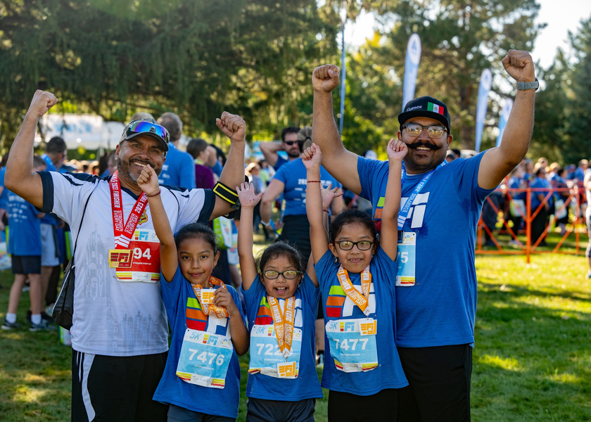 Group of people wearing colorful race gear