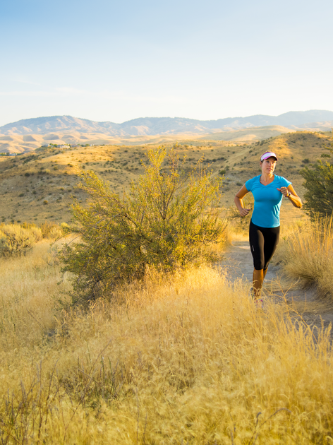 Woman runs through Boise foothills.