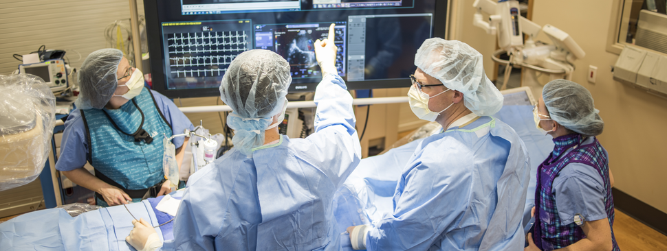 Doctors view a scan in a hospital room