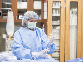 Doctor holding a IV and syringe
