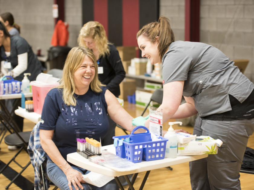  St. Luke's staff member drawing blood at a community health fair in Jerome.
