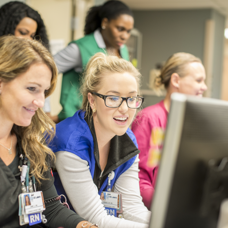 nurses at a computer workstation
