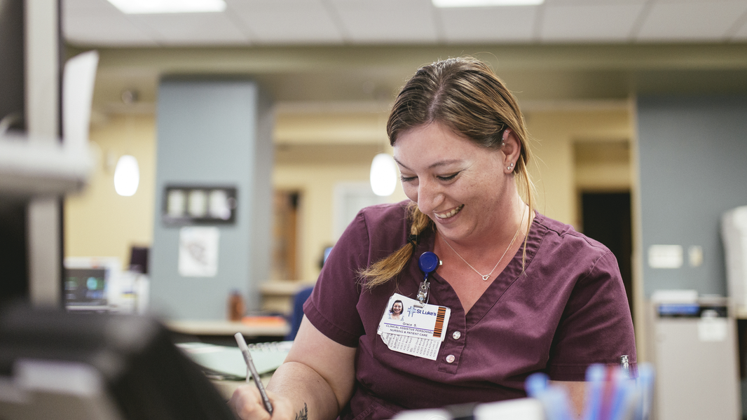 Provider smiles while working at the Twin Falls medical center.