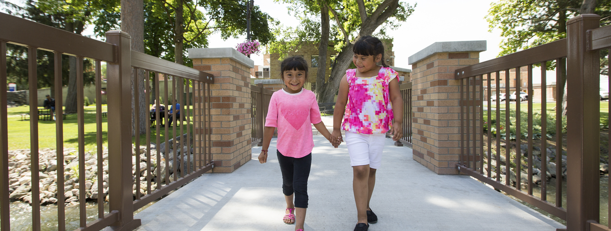 Volunteer checks oxygen levels of young child.