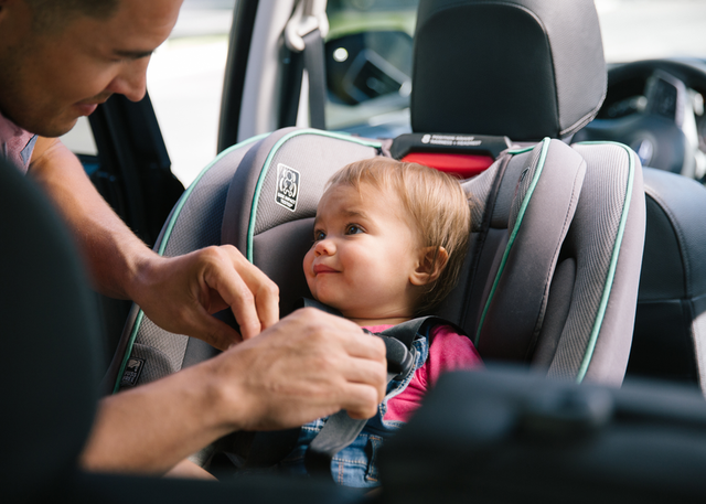 A little girl in her carseat