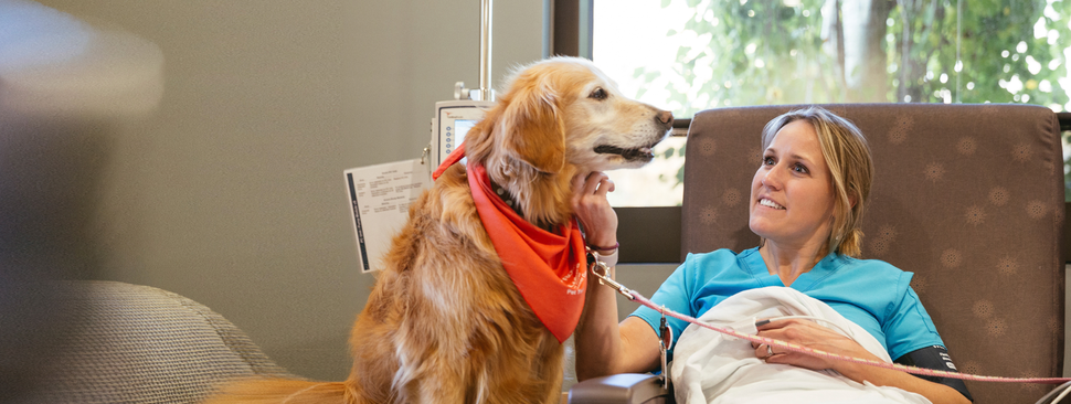 Woman with volunteer dog in the St. Luke's Wood River Medical Center