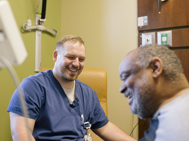 nurse laughs with patient