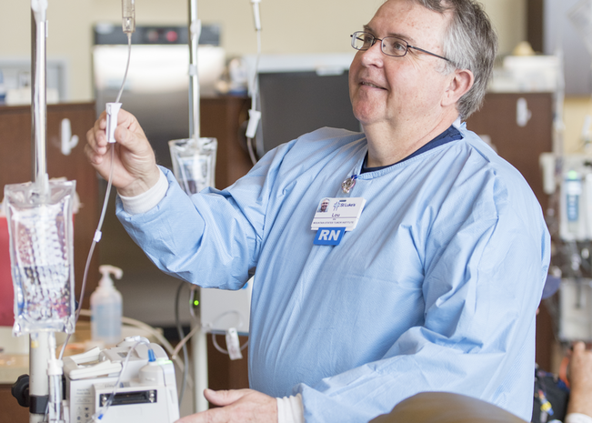 Registered Nurse checking IVs.