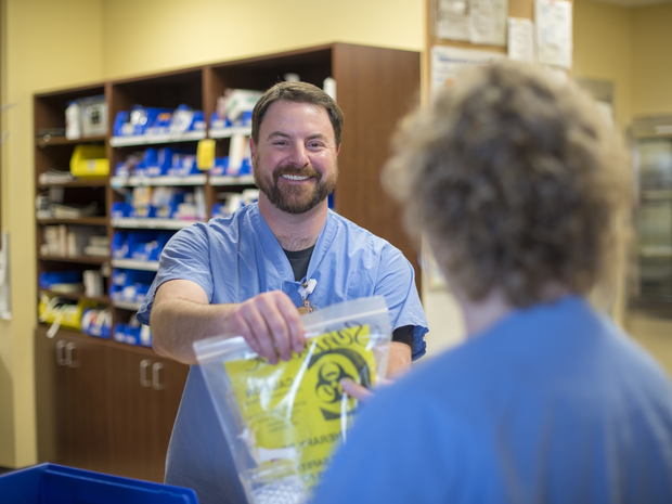 Pharmacy tech helping a patient