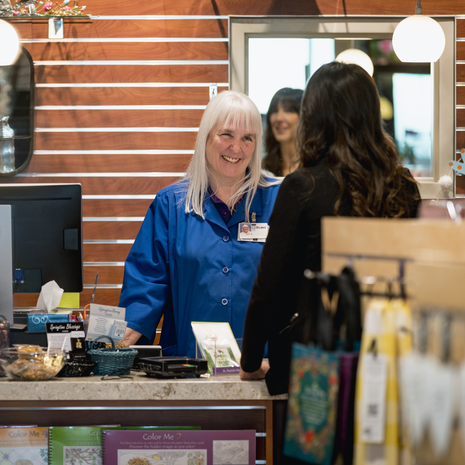 Volunteer smiling at customer