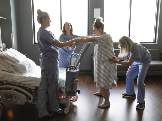 Nurses assist a woman who is in labor. 