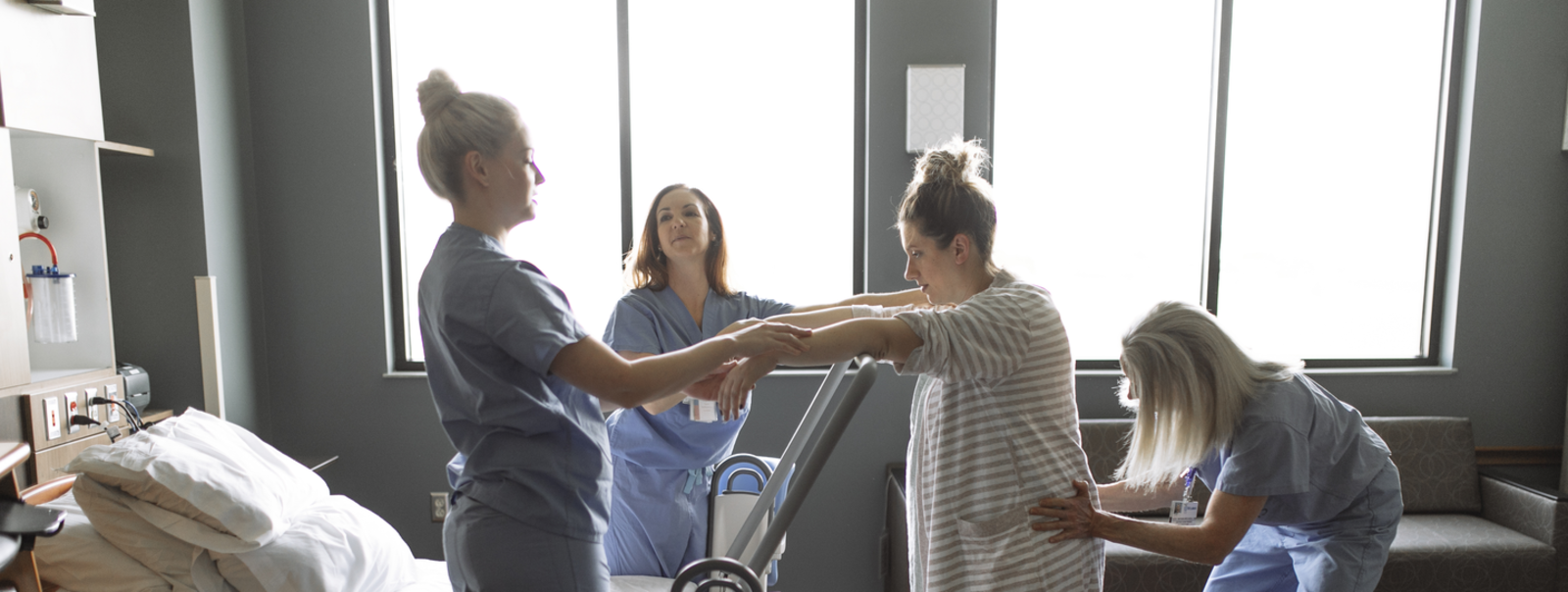Nurses assist a woman who is in labor.