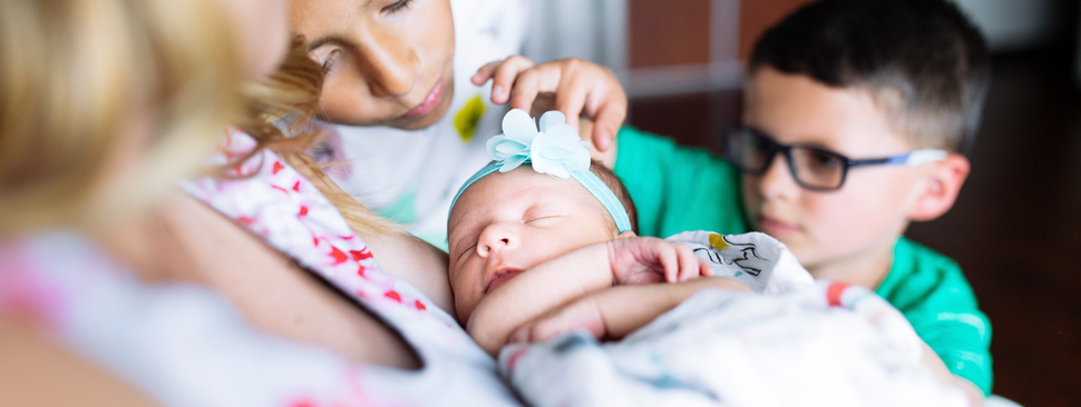Family greets new baby