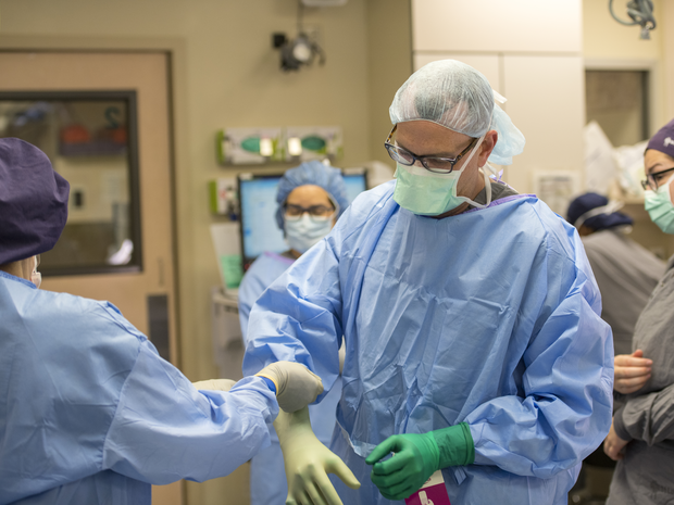 neurosurgeon preparing for surgery