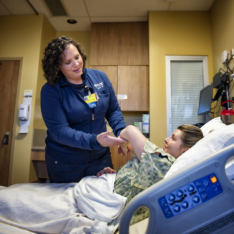 Woman smiles while working in Twin Falls gift shop.