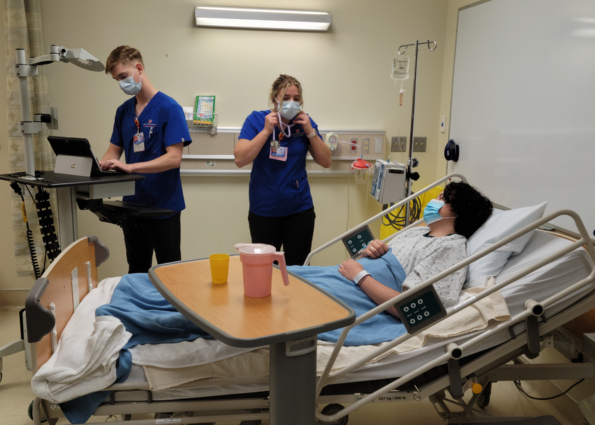 Students working in the the SIM lab. 