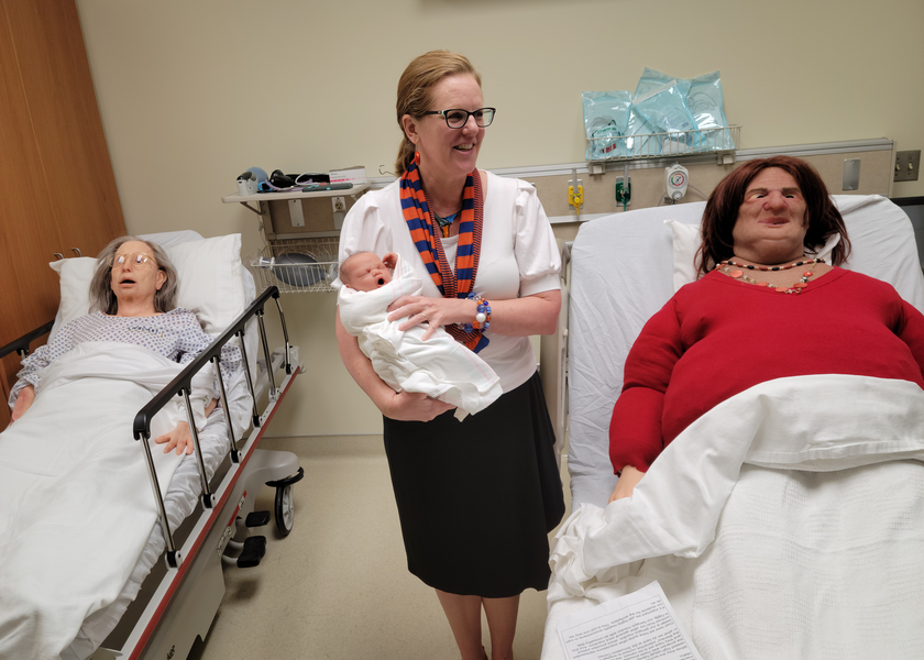  Physician with training manikins.