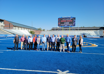 Summit members together on the Boise State University blue turf.