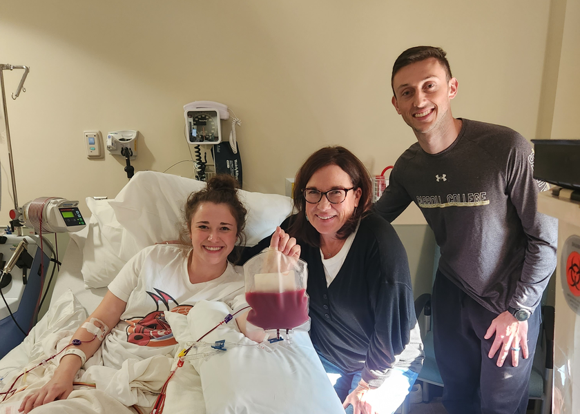  Lexi with her mom and husband. 