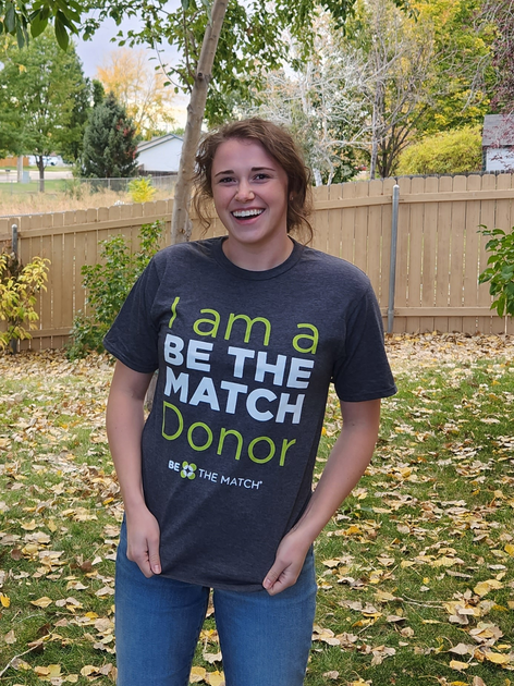 Lexi showing her Be the Match t-shirt.