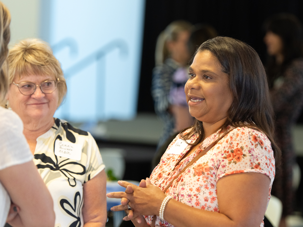 Women chat at the celebration
