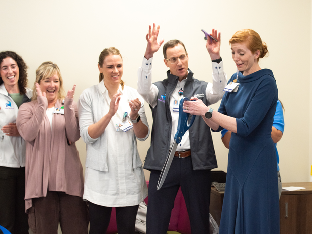 St. Luke's Children's leaders celebrate with a ribbon-cutting ceremony.
