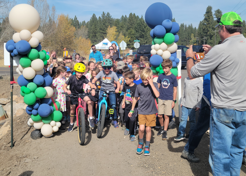 Kids give the pathway a test after a ribbon-cutting ceremony in McCall