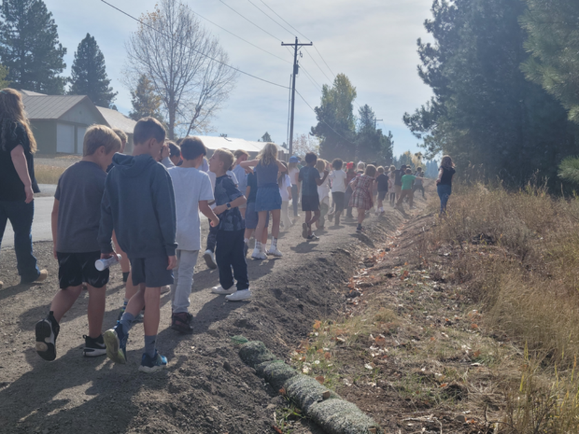 Students from McCall's elementary and middle schools tested out the new path after its ribbon cutting.