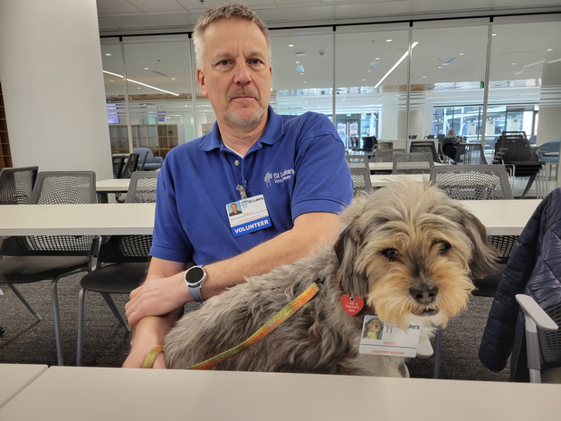 Pet therapy dog and his volunteer in St. Luke's.