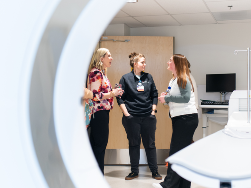  St. Luke's Boise staff standing near new PET CT scanner.
