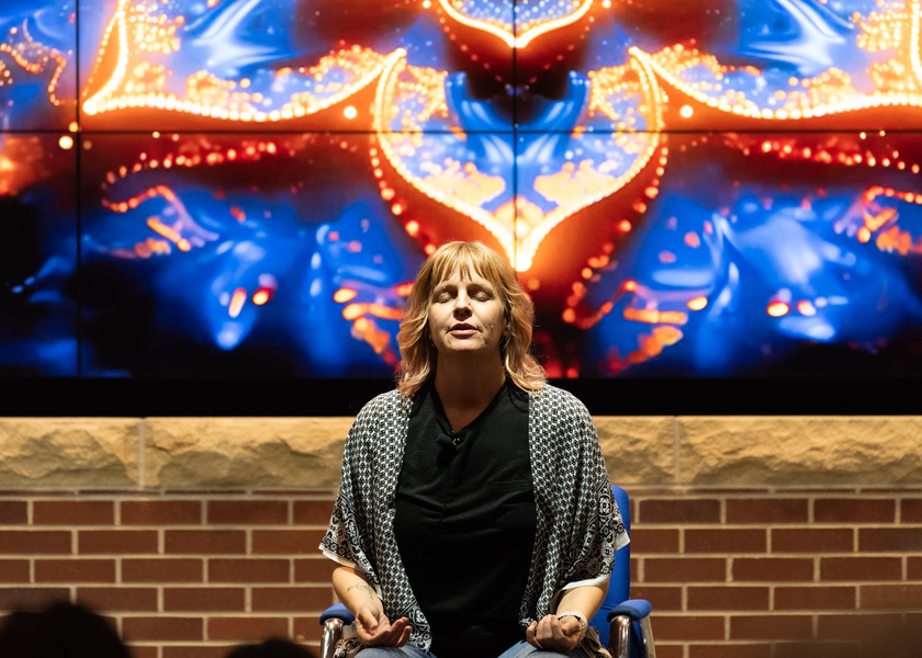 Team member leading a mindfulness exercise.