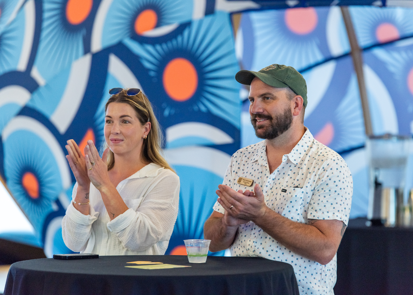 Event attendees applauding.