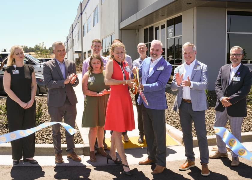 St. Luke's employees cut ribbon on new service center.