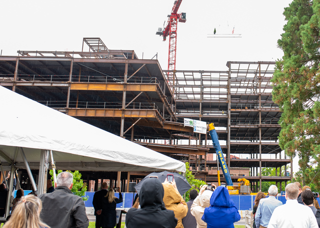 Final beam being added to new wing of hospital.