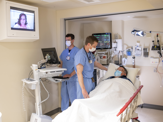 EMT staff in an ambulance with apatient.
