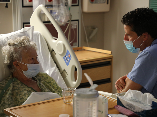 Doctor sitting with a patient at St. Luke’s McCall Hospital