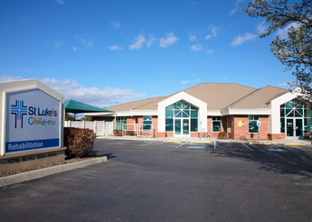 One-story clinic with sign out front