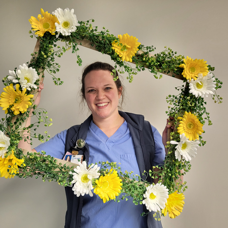 Daisy Award winner smiling with frame