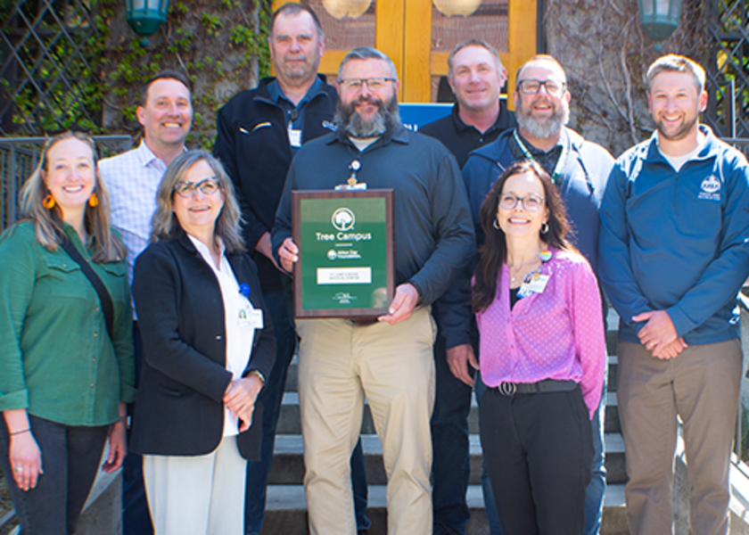St. Luke's staff members in Boise with the Tree Campus recognition plaque from the Arbor Day Foundation.