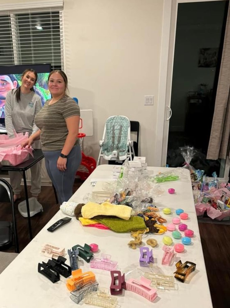  Alyssa's sisters work on the gift bags.