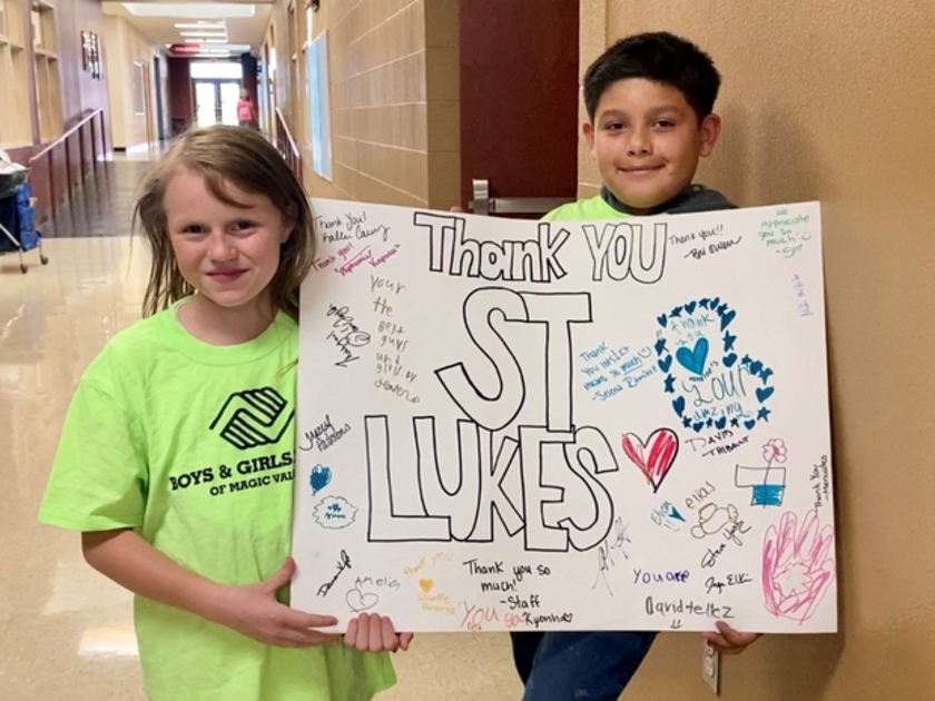  Kids from Jerome's Boys and Girls club holding a sign thanking St. Luke's