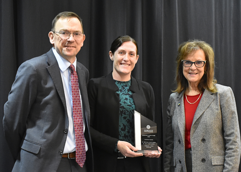 St. Luke's representative being presented with the award