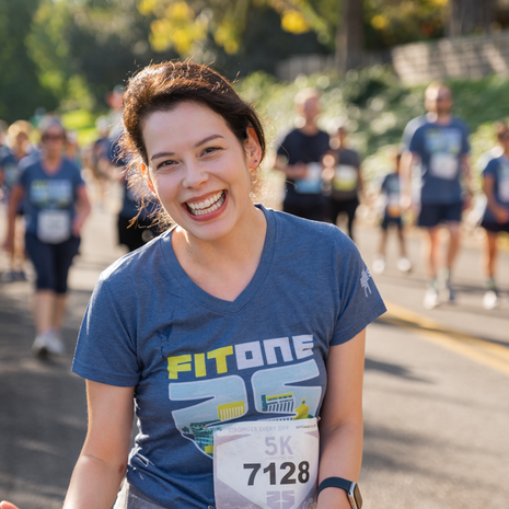 Woman smiling and wearing a FitOne t-shirt