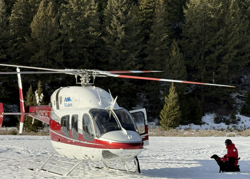 Dog and handler about to board Air St. Luke’s helicopter.