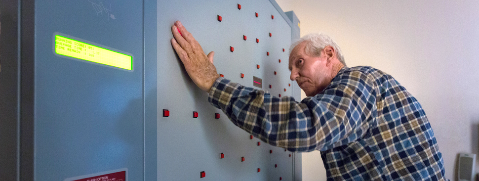 Patient using light wall in therapy gym