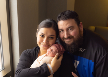 Kelly, Felan and baby Evelyn Hodge 