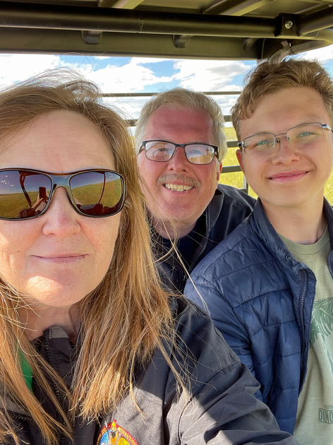  Mom, dad and son smile at camera